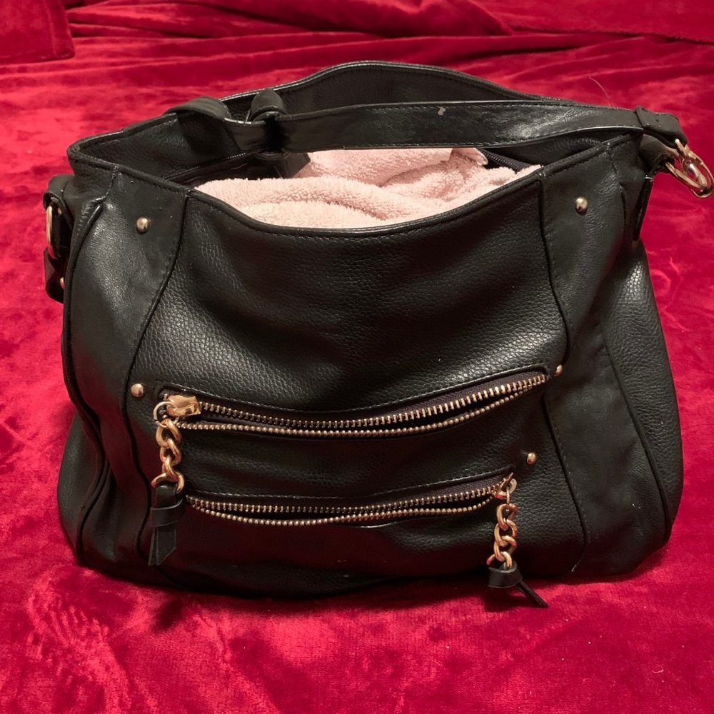 black leather purse with gold zippered pockets